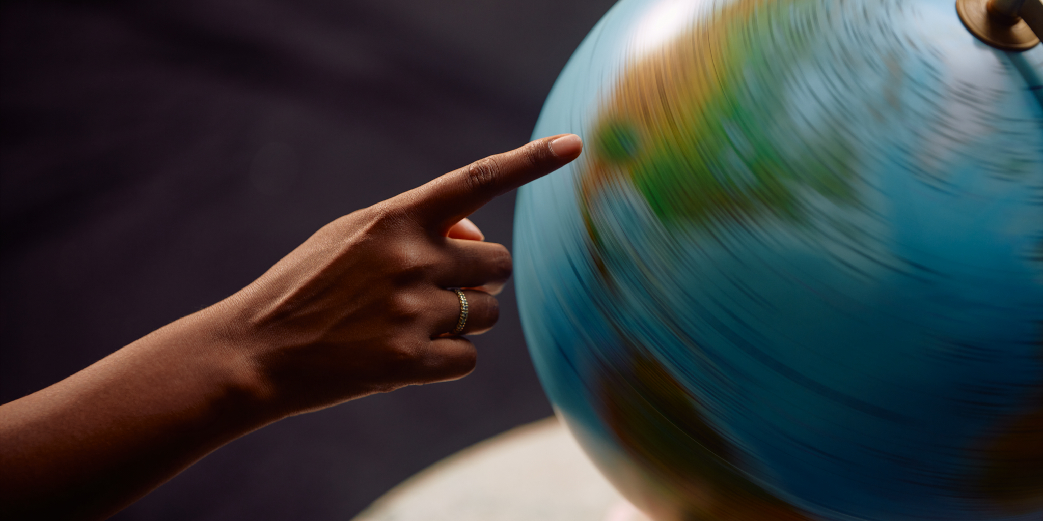 Where to travel next Hand with Globe