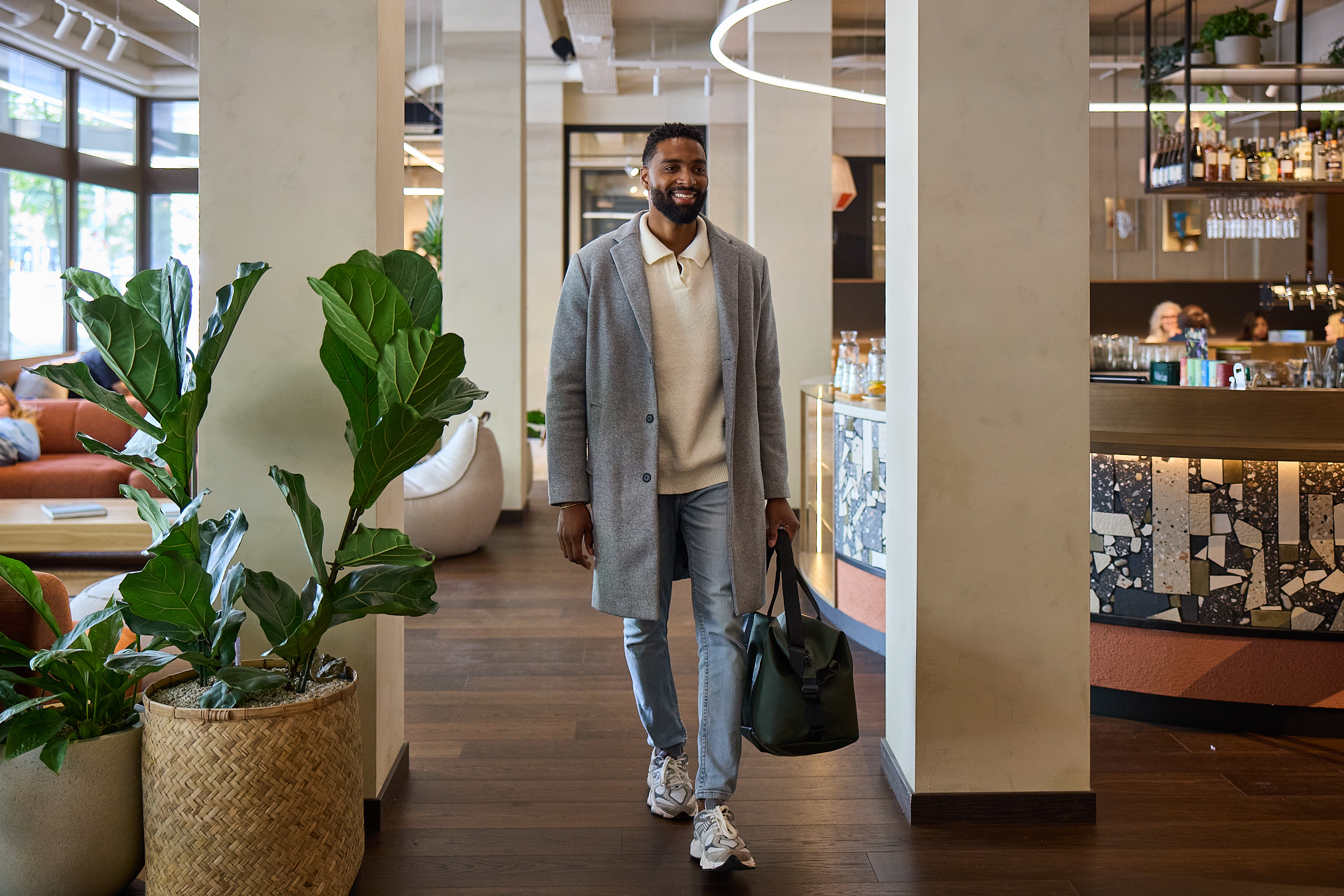 Man walking in lobby in 4-star sustainable design hotel The Usual Rotterdam